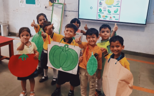 Children at the Delhi Council for Child Welfare dressed as vegetables for an educational unit