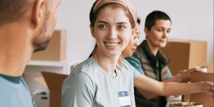 A team of smiling volunteers - Lessons in Employee Engagement for Disaster Relief