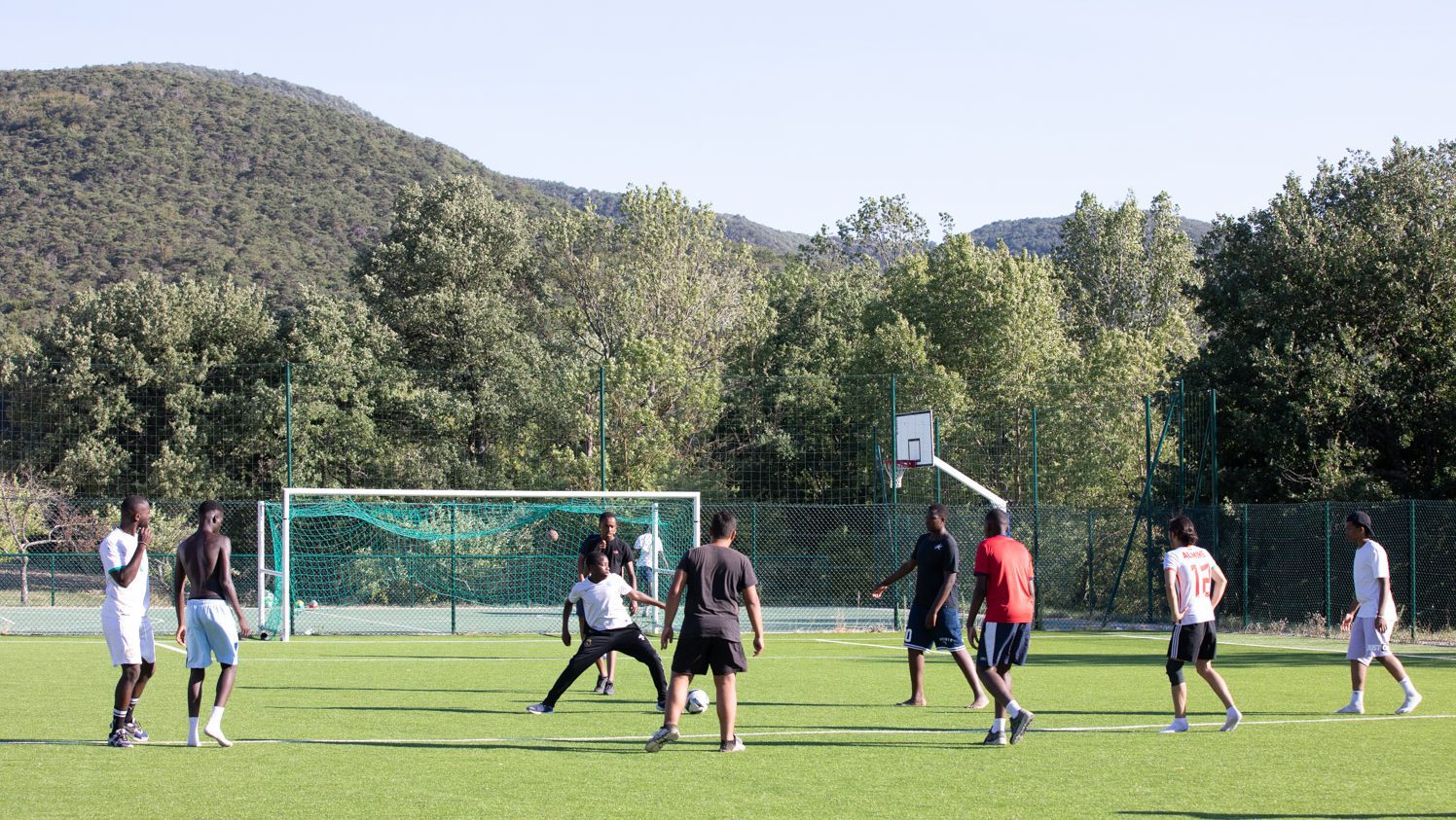 Campers playing soccer at camp