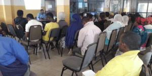 Participants sitting at a ChildFund Ethiopia meeting - Waste Management in Addis Ababa