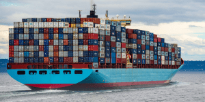 Shipping container barge on river - Enhancing Accountability of Business