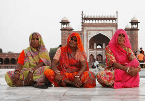 Women sitting in front of a temple - Giving to India? Compliance with the Newly Amended FCRA